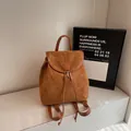 Brown frosted leather vintage backpack with drawstring flap and metal buckle closure - Brown