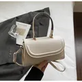 Elegant beige PU leather crossbody bag with curved flap and light gold hardware - Beige