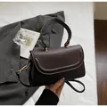 Deep brown smooth PU leather handbag with gold hardware and detachable shoulder strap - Brown