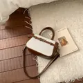 Τσάντα από καφέ δέρμα και μπεζ καμβά με διπλές λαβές και λουράκι χιαστί ώμου - Καφέ