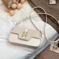 Minimalist beige saddle bag with fabric patchwork and a golden geometric clasp for women - White
