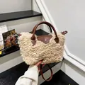 Chic beige plush hobo bag with brown leather handles and silver button closure - Milky White