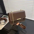 Brown patent leather shoulder bag with gold chain strap and rectangular flap design - Brown
