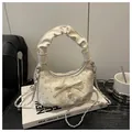 Chic off-white crescent bag with pleated handle, rhinestone accents and pearl bow detail - Champagne without Pendant