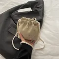 Beige woven bucket bag with floral embroidery and adjustable drawstring closure - Khaki