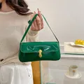 Retro forest green glossy underarm bag with gold lock and sleek patent finish - Green