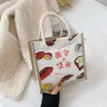 Japanese style canvas tote bag featuring bread illustrations and woven rope handles - Bread