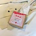 Pink strawberry milk canvas mini handbag with rope handle on stylish office outfit - Strawberry Milk Theme (Style 5)