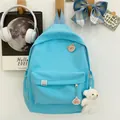 Light blue corduroy backpack with cute bear embroidery and plush charm accessory - Blue