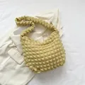 Minimalist light yellow shoulder bag in textured waffle fabric with soft pleated design - Yellow