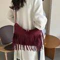Minimalist burgundy suede crossbody bag with long tassels and double zipper closure - Red