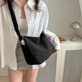 Large black corduroy messenger bag for women with a cute white dog charm pendant - Black