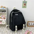 Minimalist black bubble texture backpack with cream straps and adjustable buckles - Black