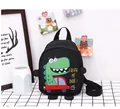 Close-up of toddler dinosaur backpack with yellow Follow Me Dude text and green cartoon print - Black
