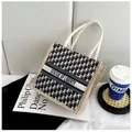 Canvas tote bag with Statue of Liberty lettering and braided rope handles in a stylish setup - Black White Geometric (Style 2)