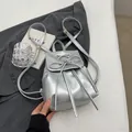 Silver metallic mini backpack for women featuring cute bow knot and adjustable straps - Silver