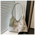 White butterfly print tote bag with star patterns and a matching small green pouch - Green