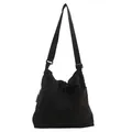 Minimalist black canvas tote bag with drawstring closure and adjustable strap - Black