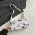 Witte minimalistische hobo schoudertas met vlinder- en sterrenstelsel print details - Zwart