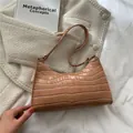 Light brown faux crocodile leather hobo bag with embossed texture and metal buckle - Khaki