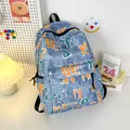 Mochila de nailon azul claro con estampado de grafiti naranja y blanco para estudiantes - Azul