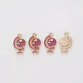 Detail of pink enamel globe pendant with golden alloy finish and radiant metal texture - Purple