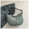 Light green corduroy half-moon crossbody bag with embroidered letter details - Light Green