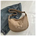 Khaki corduroy crescent bag with white embroidery and adjustable shoulder strap - Khaki