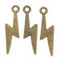 Three vintage bronze lightning bolt pendants for DIY jewelry making on white backdrop - Antique Bronze