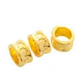 Three gold celestial barrel beads with sun and moon engravings for DIY bracelets - Gold