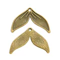 Two vintage bronze zinc alloy whale tail charms for DIY jewelry and ocean crafts - Antique Bronze