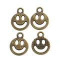 Colgantes de cara sonriente en bronce vintage para joyería DIY y llaveros - Bronce Antiguo