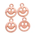 Set de cuatro colgantes de carita sonriente en oro rosa con acabados liso y texturizado - Rosa oro