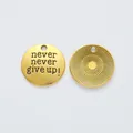 Vintage gold zinc alloy round charm with engraved 'never never give up!' motivational text - Antique Gold