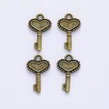 Set of four vintage bronze alloy heart-shaped key charms for DIY jewelry making - Antique Bronze