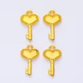 Macro view of vintage gold alloy heart-shaped crown key pendants for DIY jewelry making - Gold