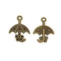 Vintage bronze umbrella charms for DIY jewelry making with floral texture detail - Bronze