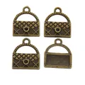 Set of four vintage bronze handbag charms with quilted patterns and circular rings - Antique Bronze