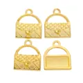 Macro view of gold-plated handbag charms with classic quilted patterns for DIY crafts - Gold