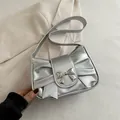 Metallic silver underarm bag with pleated bow design and chic metal buckle detail - Silver