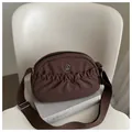 Brown nylon crescent crossbody bag featuring pleated design and wide canvas strap - Brown