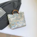 Oriental style blue floral jacquard tote bag with authentic bamboo top handles - Blue
