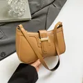 Light brown PU leather crescent shoulder bag with golden buckle and zipper closure - Khaki
