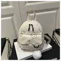 Minimalist beige corduroy backpack with smiley face print and plush ball pendant charm - White