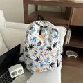 White canvas backpack with tropical black palm tree and pineapple patterns in casual style - Tropical Plant Print (Pattern 1)