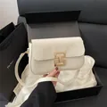 Minimalist cream white leather square shoulder bag with gold metal buckle closure - White