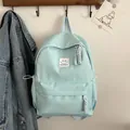 Sac à dos bleu clair minimaliste en nylon menthe avec étiquette mode pour étudiants - Bleu