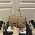 Khaki lychee texture handbag with golden buckle and adjustable crossbody strap - Khaki