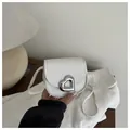 Mini white heart saddle bag for girls featuring silver metal buckle and lychee leather - White