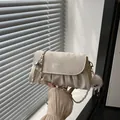 Chic off-white pleated crossbody bag with metal chain strap and cute plush ball charm - With Pendant / White